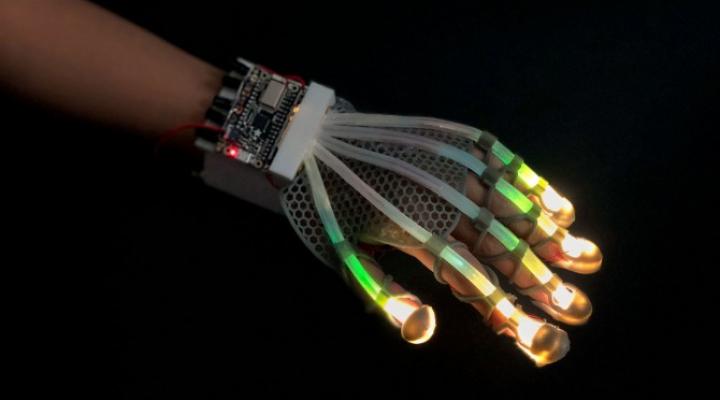 3D-printed glove lined with stretchable fiber-optic sensors that use light to detect a range of deformations in real time.