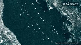 Dozens of oil tankers and commercial cargo ships line up at Great Bitter Lake to enter the Suez Canal in this early April satellite image provided by Ursa Space.